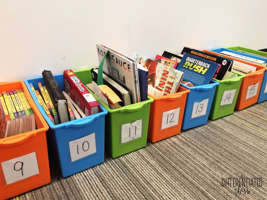 Student book bins labeled with numbers
